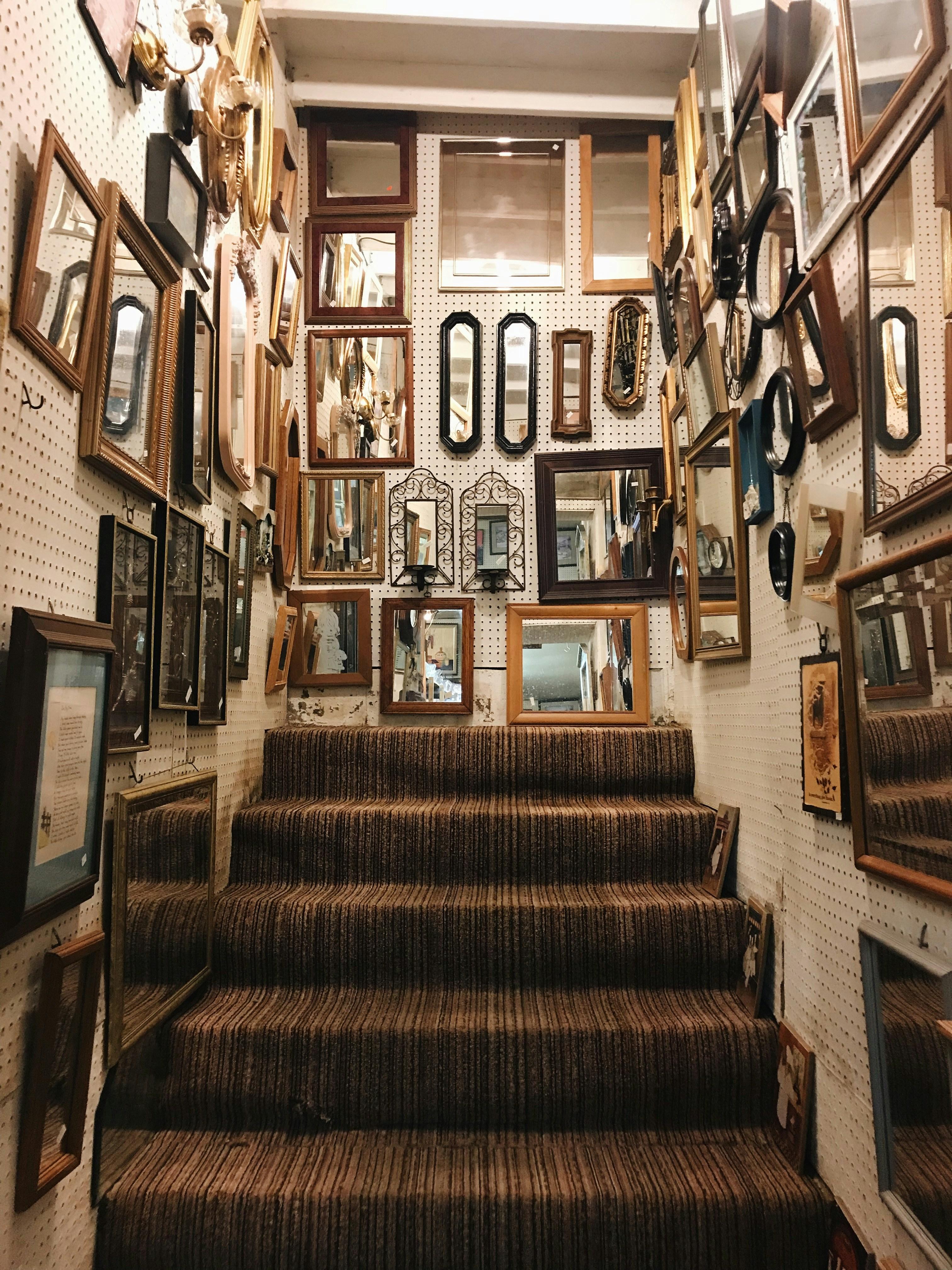 a staircase lined with framed family photographs