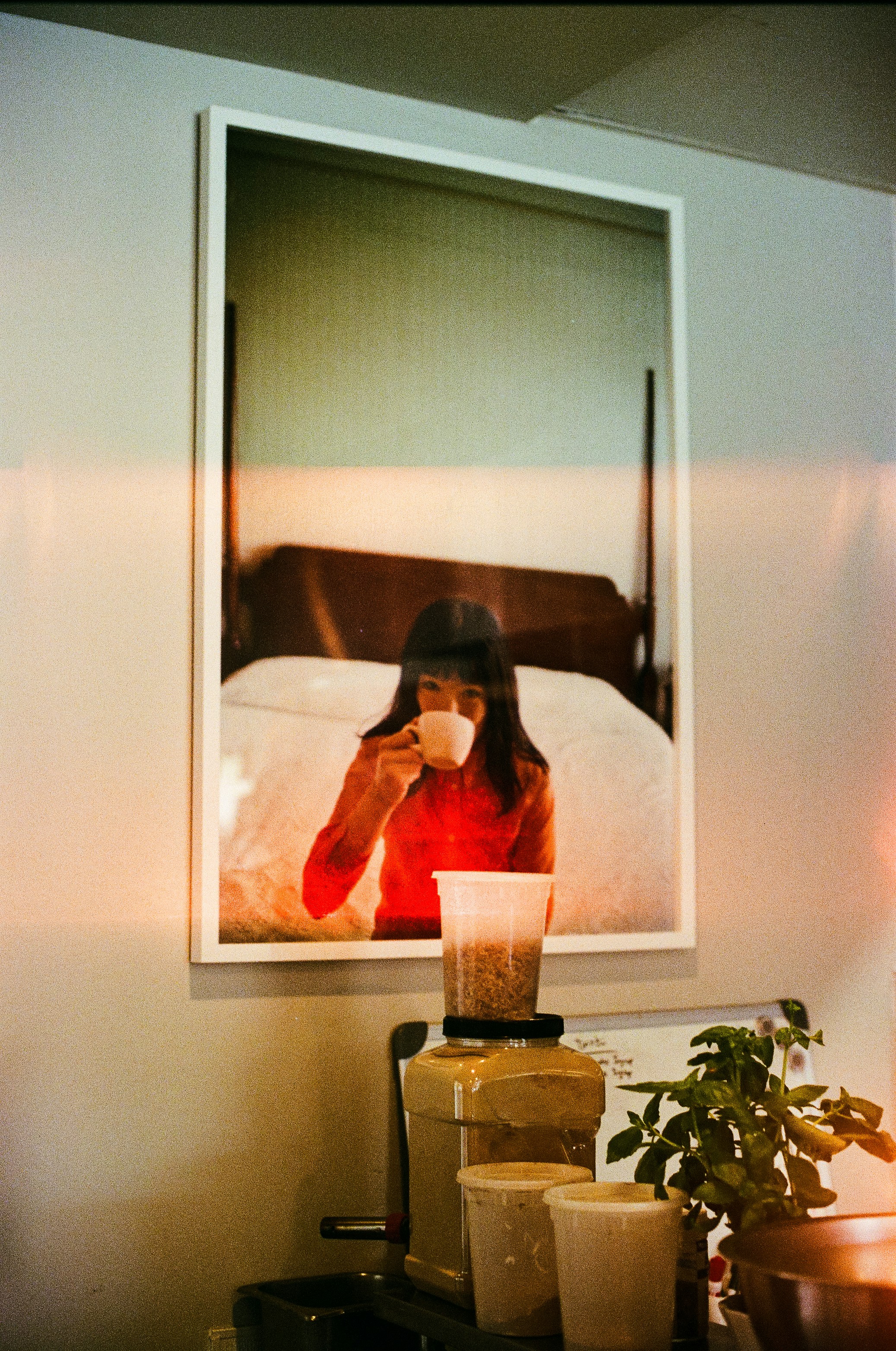 a woman on a video call in a warm lamplit room