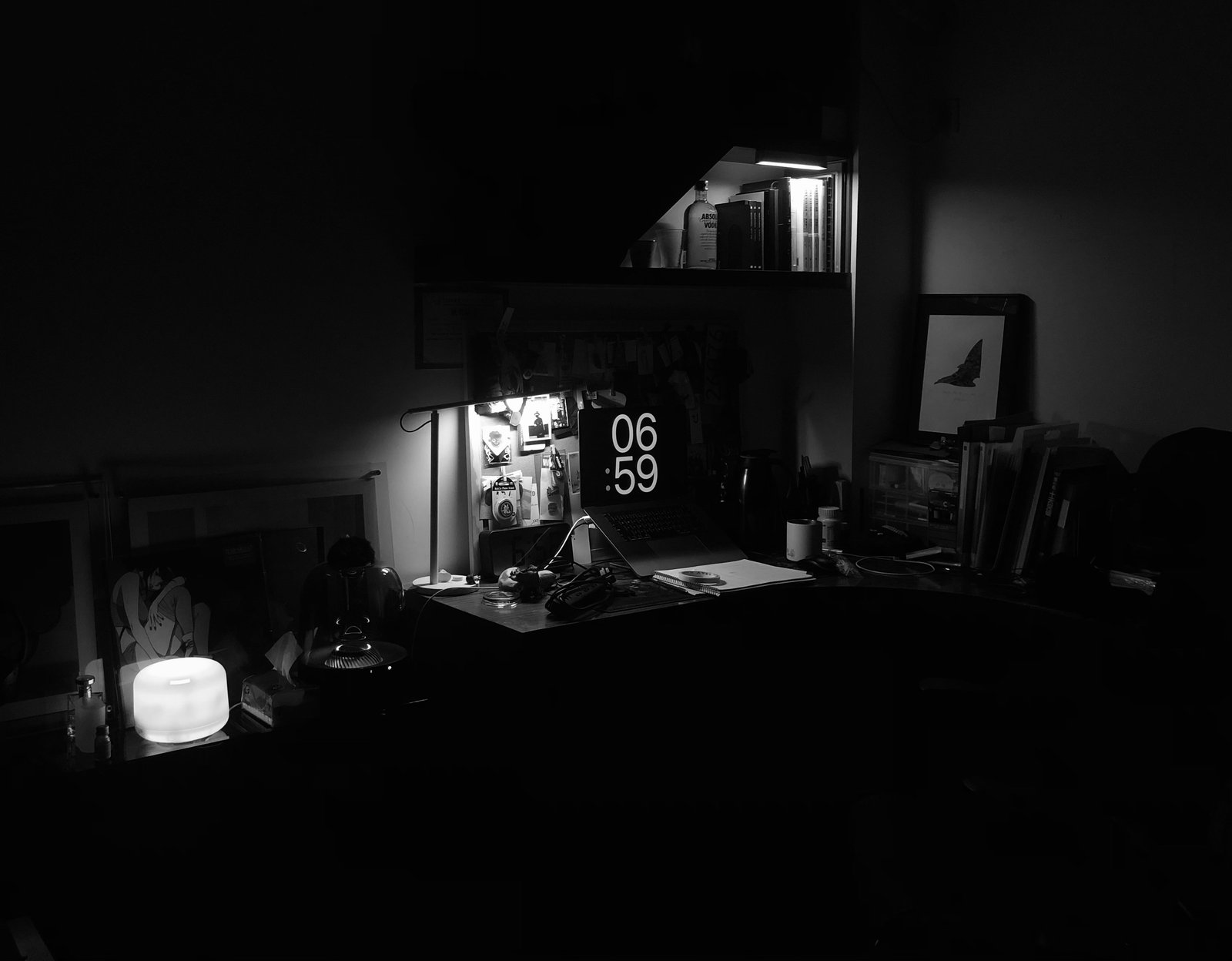 A teenager sitting up in bed at night, phone lit in dim room, digital clock reading well past midnight on the nightstand.