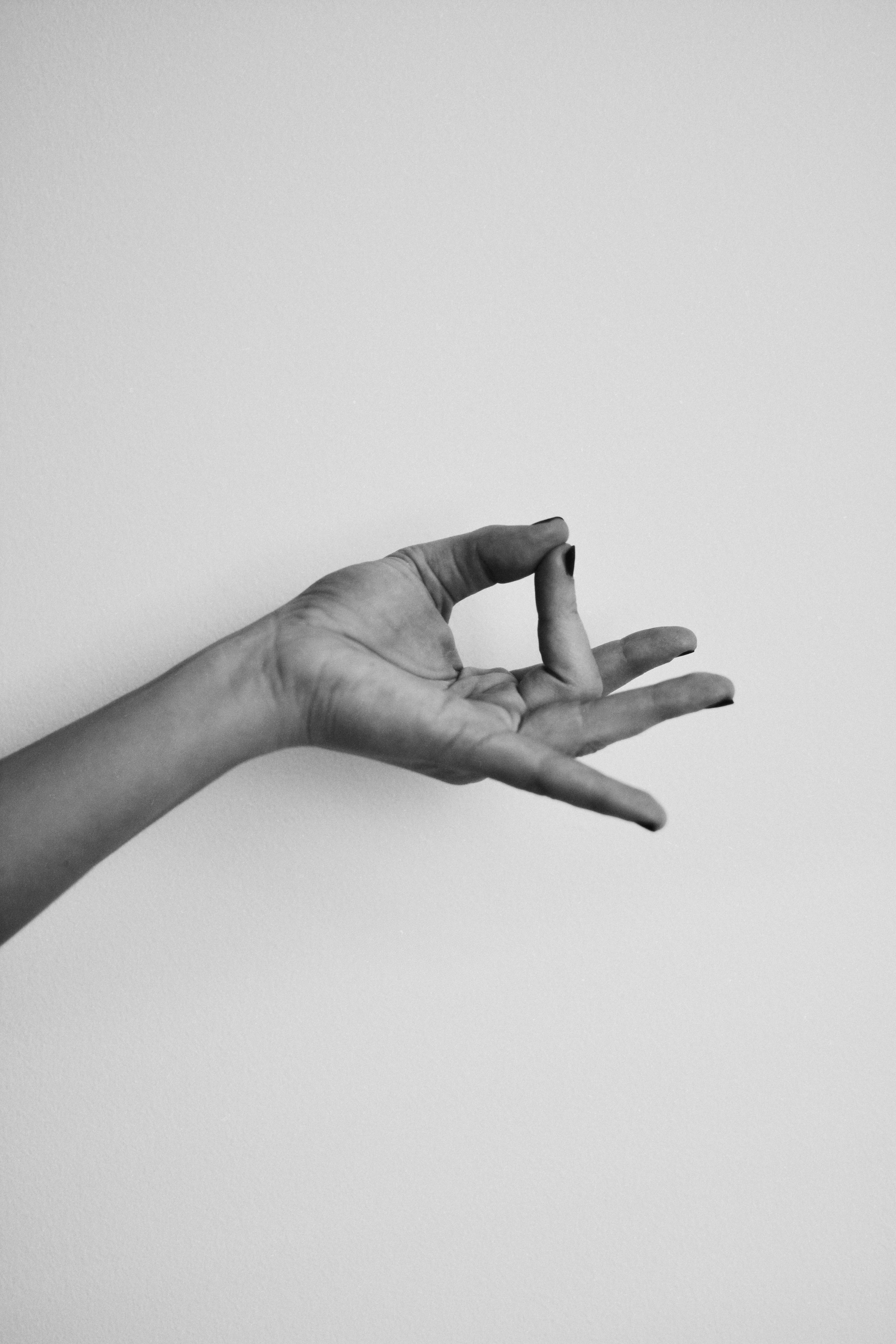 an open hand against a plain wall